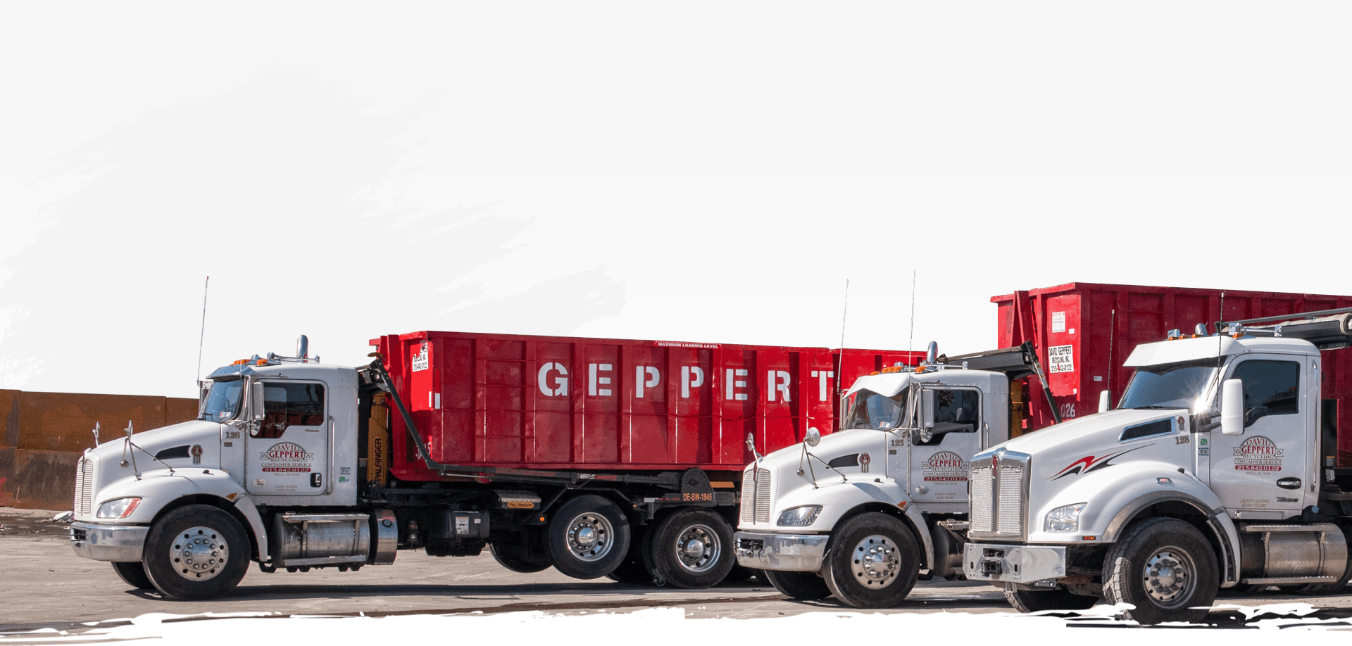 Truck unloading a dumpster
