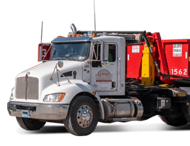 Truck unloading a dumpster