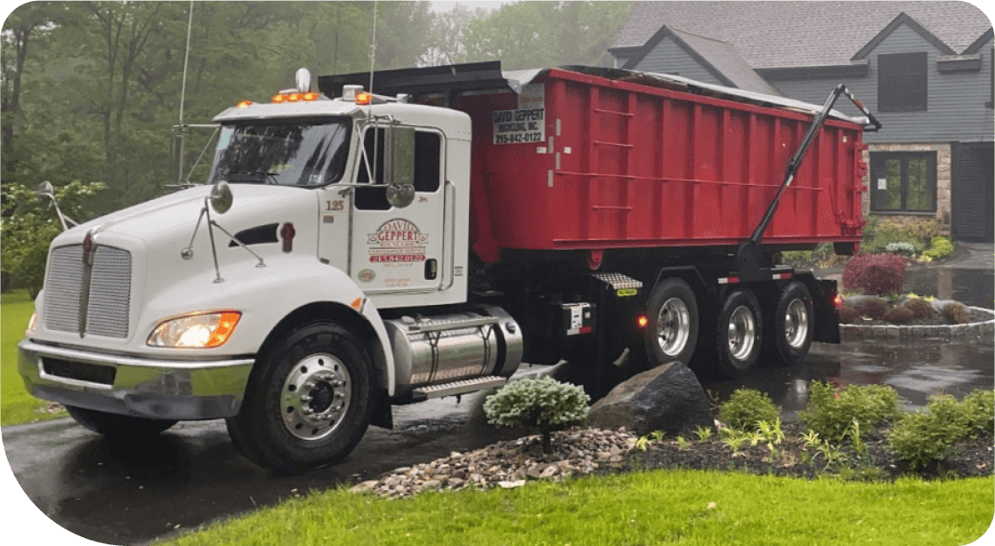 Truck unloading a dumpster