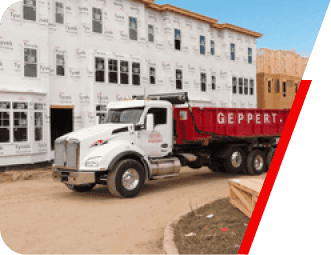 Truck unloading a dumpster