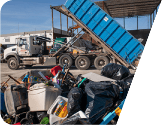 Truck unloading a dumpster